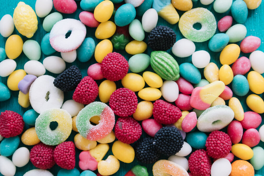 Colourful assortment of custom branded candy with company logos
